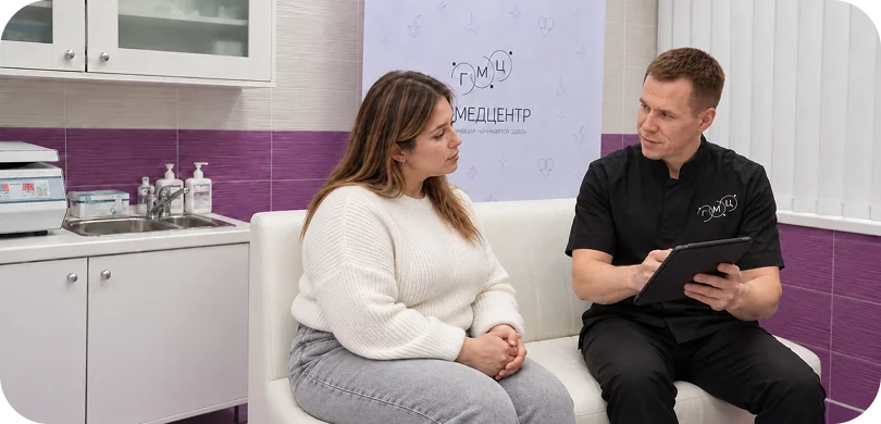 A bariatric surgeon discusses a treatment plan with a patient