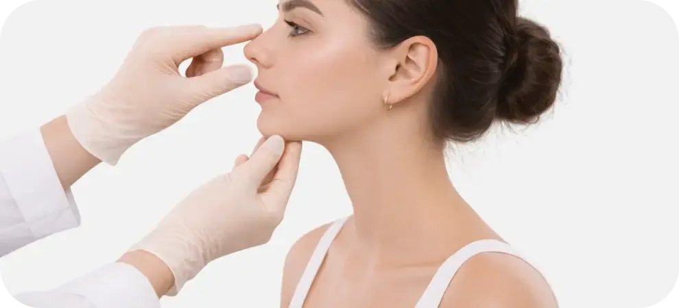 A doctor examines the shape of the nose