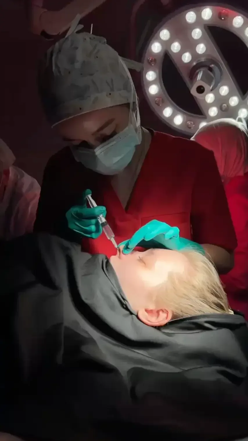 Surgeon shaping the nose during surgery